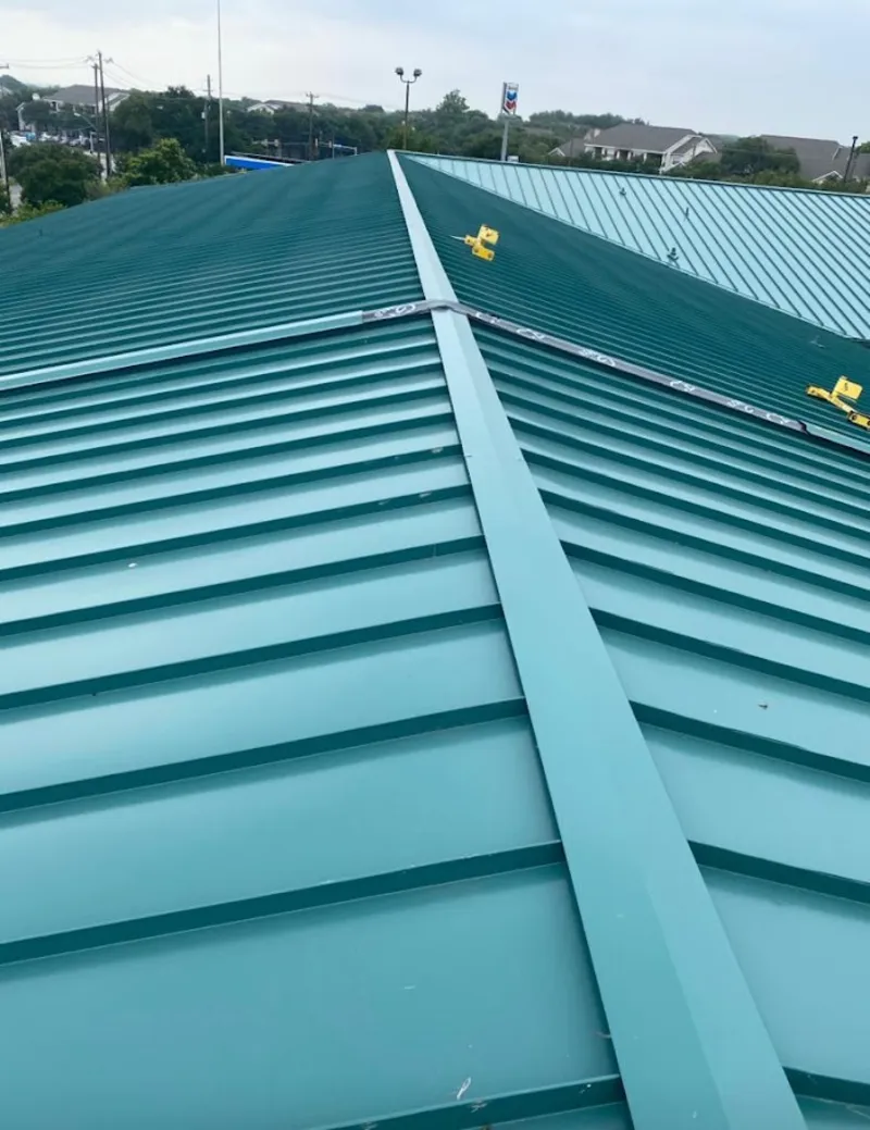 Green commercial metal roof ridge and valley for Metal Roof Repair in Maplewood